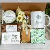 Nature lover 50th birthday gift basket with custom name mug, coffee, an assortment of treats, engraved spoon, and candle with tree of life mug.