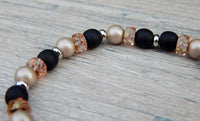 black and beige beaded bracelet