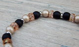 black and beige beaded bracelet