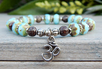 blue beaded yoga bracelet with Om charm