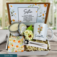 Thinking of your sister: personalized gift basket with mug, spoon, coaster, candle, and a loving message, in a daisy theme.