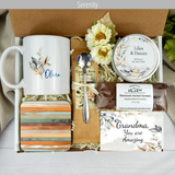 Thoughtful gift for Grandma: Gift basket featuring a personalized name mug, candle, engraved spoon, biscotti, and coffee.