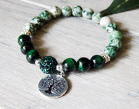 green gemstone bracelet with tree of life charm