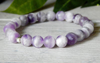 purple and white beaded bracelet