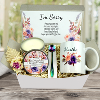 Apology-themed gift basket with keepsake coffee cup