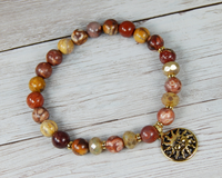earthy red beaded bracelet sun charm
