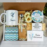 Warm Wishes for Retirement: Care package for her with a personalized name mug, coffee, comforting goodies, engraved spoon, and candle.