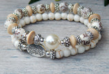 stacked white beaded bracelets