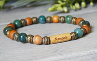 green and brown word bead bracelet