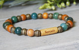 green and brown word bead bracelet